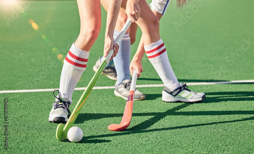 Hockey stick, hockey ball and turf competition, sports games and challenge on grass field, pitch and outdoor. Women team, field hockey players and contest, action and sport training on stadium arena photo