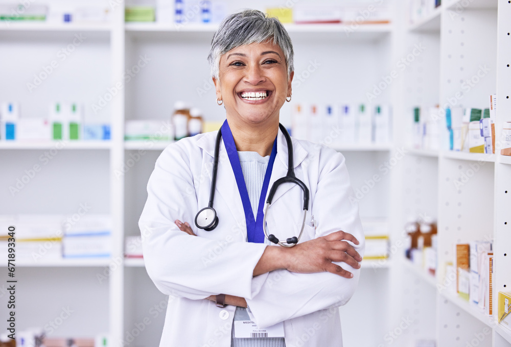 Senior woman, pharmacist with arms crossed or portrait of doctor in pharmacy, pharmaceutical store or shop for healthcare. Medicine, consultation on health and confident in medical advice on pills Senior woman, pharmacist with arms crossed or portrait of doctor in pharmacy, pharmaceutical store or shop for healthcare. Medicine, consultation on health and confident in medical advice on pills