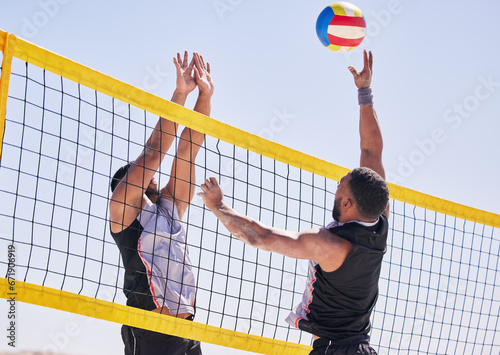 Beach, volleyball and team with competition at ocean and sea with exercise, sport and fitness. Summer, outdoor and training people playing for health, action games and workout with ball in nature