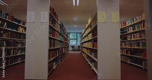 Books stacked on shelves in a library at a college