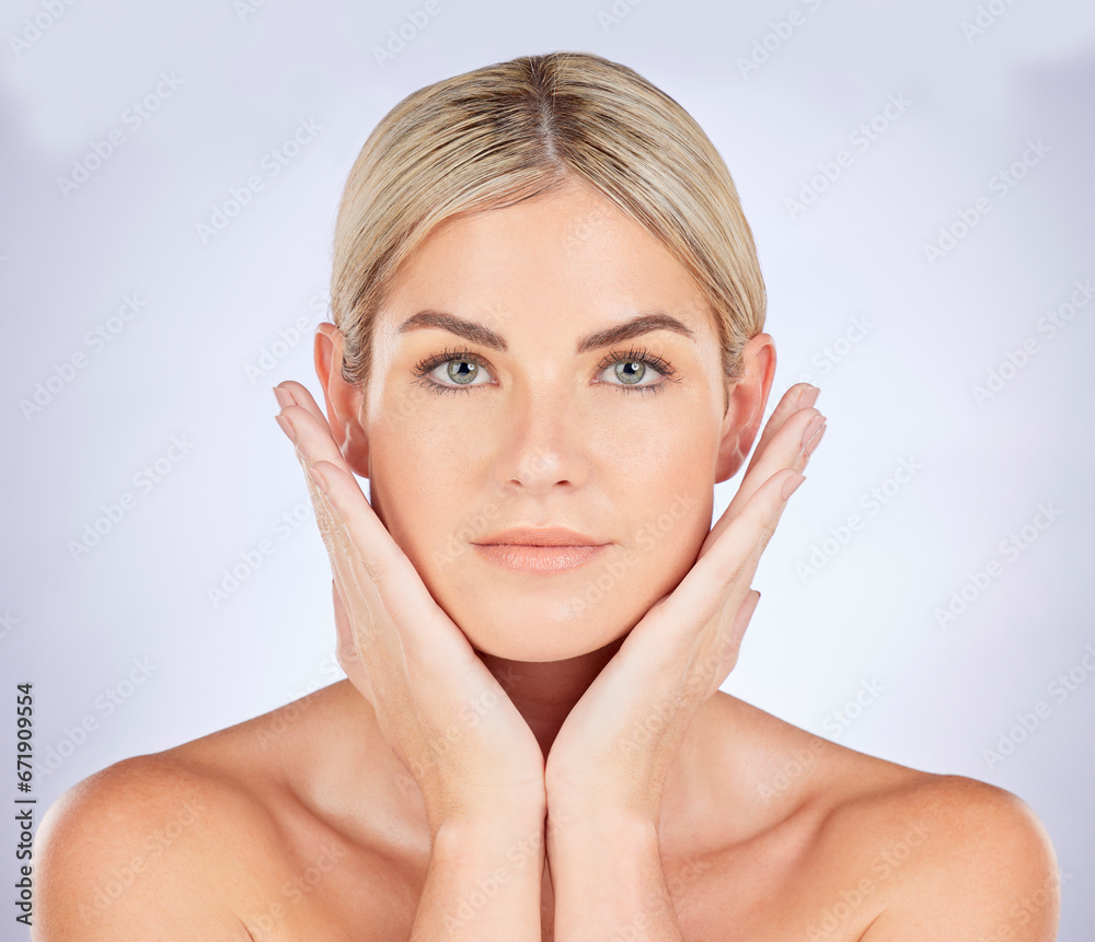 Beauty, skincare and hands on face of woman in studio for natural makeup, cosmetic or luxury dermatology on grey background. Portrait, soft skin and lady wellness model touch soft or perfect results Beauty, skincare and hands on face of woman in studio for natural makeup, cosmetic or luxury dermatology on grey background. Portrait, soft skin and lady wellness model touch soft or perfect results