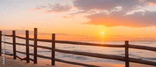 Wooden fence in front of a beach at sunset from Generative AI
