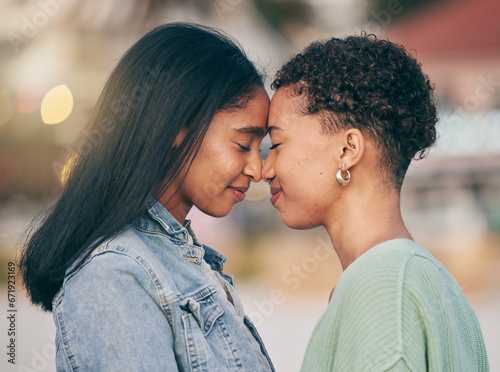 Lesbian, love and intimate couple outdoor, bonding and romance on date together. Happy, gay women and forehead touch for care, commitment and loyalty, trust and support for lgbtq, queer or homosexual
