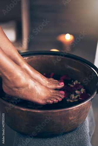 Obraz na plátně Spa, health and woman feet in water to soak with flowers for a luxury, glamour and pedicure treatment