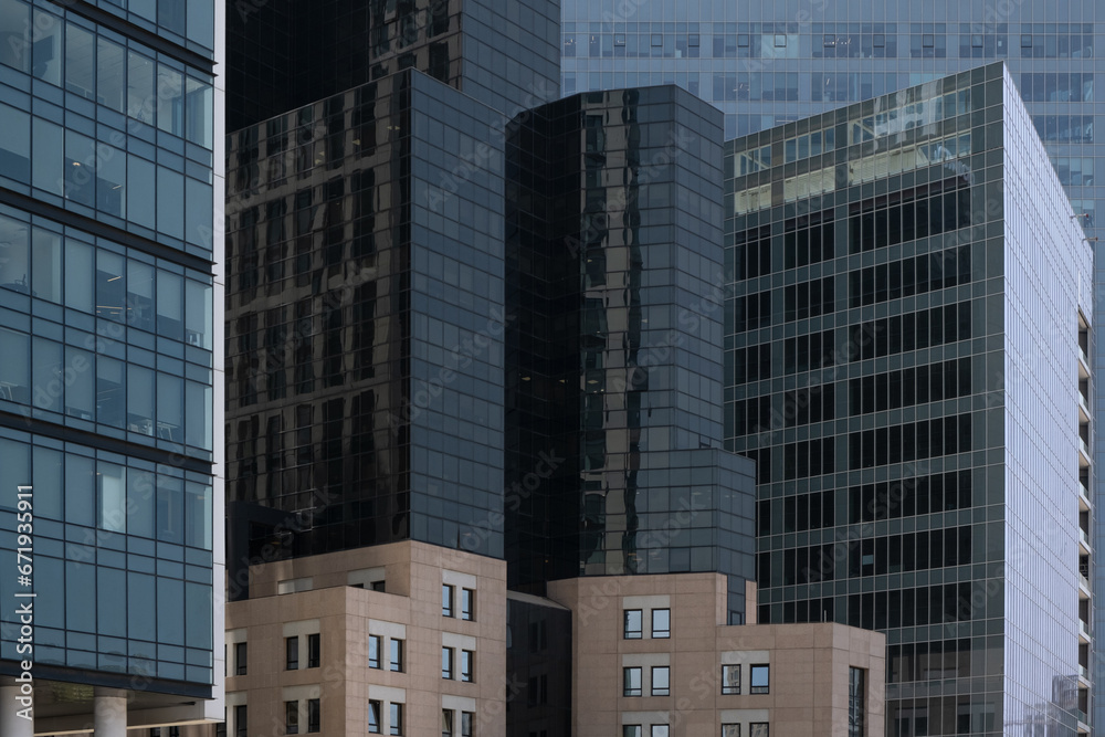 Modern office buildings in Israel feature impressive glass facades and windows, creating a captivating abstract architecture background