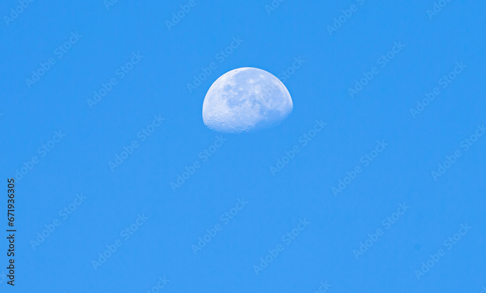 Moon in the blue sky, natural background, closeup of photo