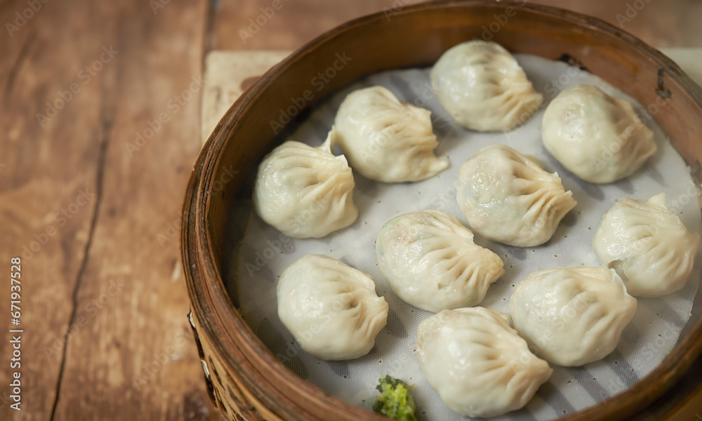 Dumplings in a wooden steamer Dumplings in a wooden steamer
