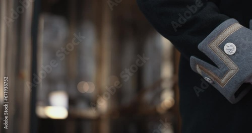 Lobby greeter standing in front of revolving doors and entrance to the hotel