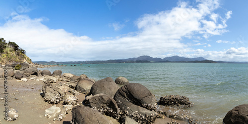 Koutu Boulders: Coastal Rock Formations along Tasman Sea Shoreline in Northland Region, New Zealand photo