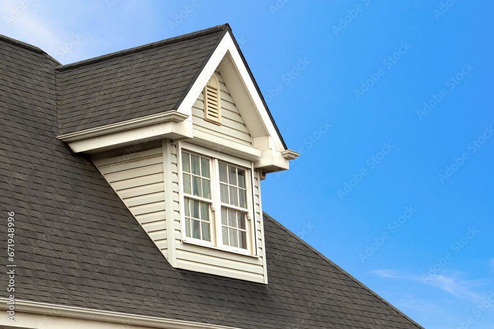 Charming House with Dormer in Clear Blue Sky