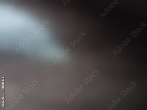 Abstract blurred background image of black color gradient used as an illustration. Designing posters or advertisements.