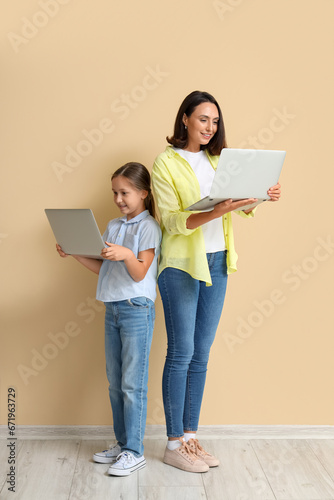 Mother and daughter with la...