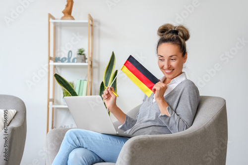 Mature woman with laptop st...