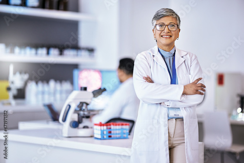 Fototapeta Naklejka Na Ścianę i Meble -  Portrait, research and senior woman with arms crossed, medical and success with lab equipment, smile and development. Female person, confident and healthcare professional with science and innovation