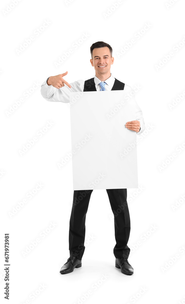 Handsome steward pointing at blank poster on white background Handsome steward pointing at blank poster on white background