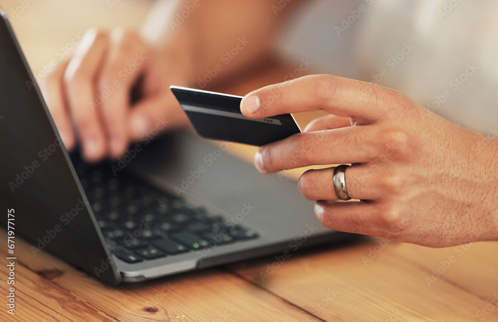 Payment, credit card and hands with a laptop for online shopping, banking and finance. Ecommerce, retail and person typing debit information into a pc for a convenient electronic purchase on the web Payment, credit card and hands with a laptop for online shopping, banking and finance. Ecommerce, retail and person typing debit information into a pc for a convenient electronic purchase on the web