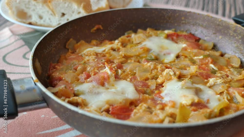 Turkish Menemen omelet in a frying pan. . Turkish Menemen omelet in a frying pan. .