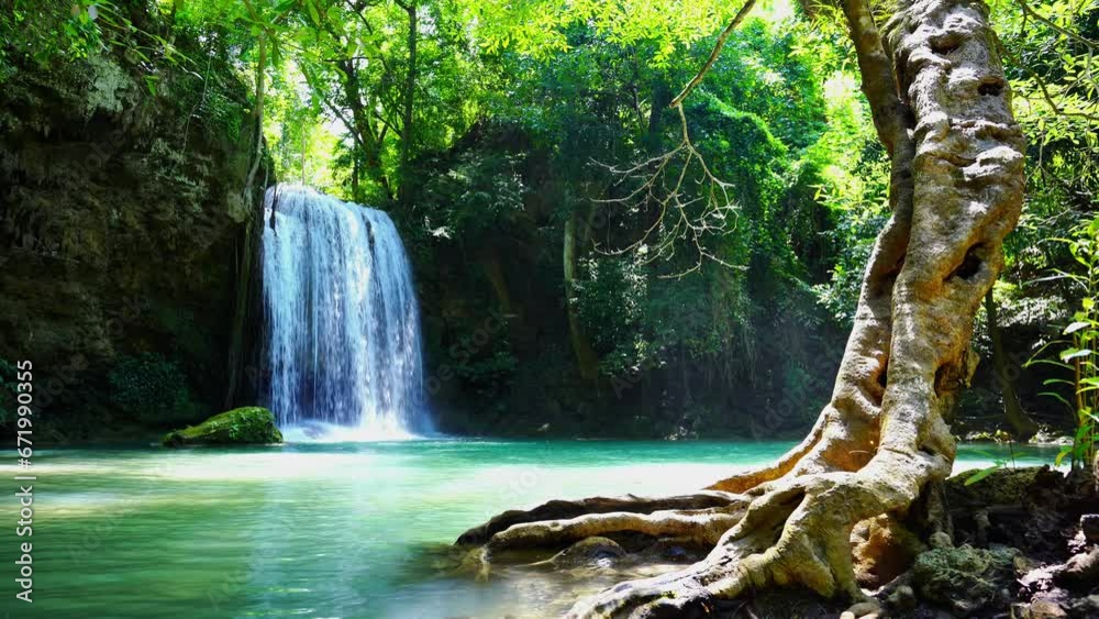 Waterfalls and fish swim in the emerald blue water in Erawan National Park. Erawan Waterfall is a beautiful natural rock waterfall in Kanchanaburi, Thailand.Onsen atmosphere