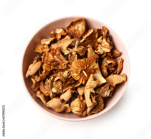 Pink bowl with tasty dried mushrooms on white background