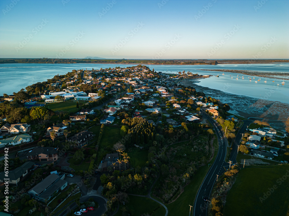 Aerial Sunset View of Houses Overlooking the Bay and Mount Manganui from Omokoroa, New Zealand