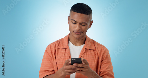 Doubt, confused and man with a smartphone, typing and connection on a blue background. Person, guy and model with a cellphone, mobile user and reaction with error 404, phishing and contact with app © Wesley JvR/peopleimages.com