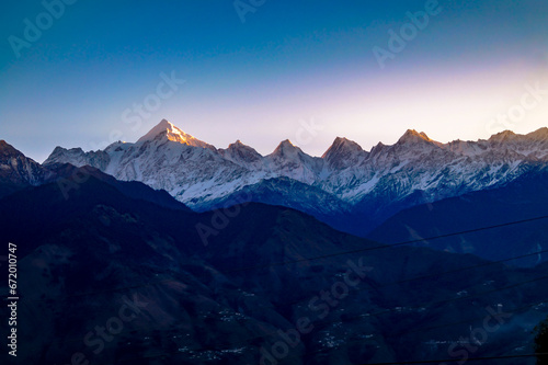 Fototapeta Naklejka Na Ścianę i Meble -  The Pachachulli Mountain Range at the time of Sunrise in Munsiyari , Uttarakhand India