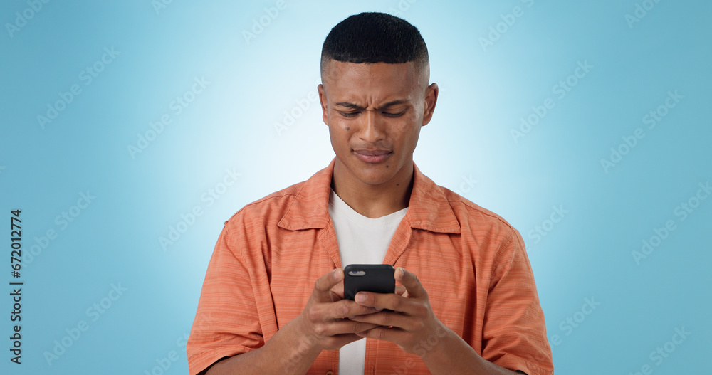 Doubt, confused and man with cellphone, typing and connection with digital app on blue background. Person, guy and model with smartphone, mobile user or reaction with expression, error 404 or contact Doubt, confused and man with cellphone, typing and connection with digital app on blue background. Person, guy and model with smartphone, mobile user or reaction with expression, error 404 or contact