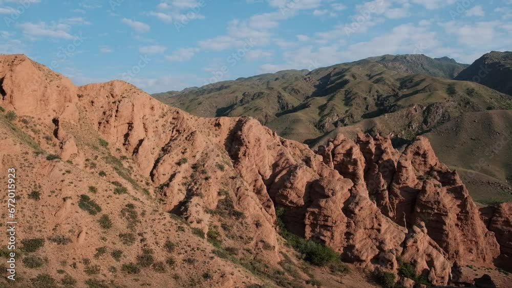 Tract Zhaman uy in a mountains of Kazakhstan on platey Assy. Fantastic clay remains of red color