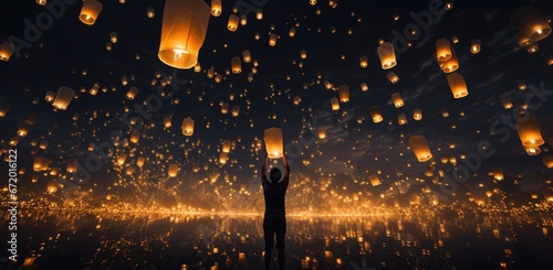 Floating lantern with flame in the night sky background. photo
