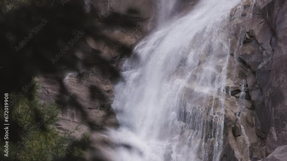Waterfall rushing down the rocks. Sunset. Shannon Falls, Squamish, BC, Canada. Nature Background. Slow Motion Waterfall rushing down the rocks. Sunset. Shannon Falls, Squamish, BC, Canada. Nature Background. Slow Motion