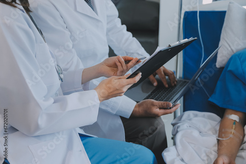 Injured patient showing doctor broken wrist and arm with bandage in hospital office or emergency room. Sprain, stress fracture or repetitive strain injury in hand. Nurse helping customer. First aid.