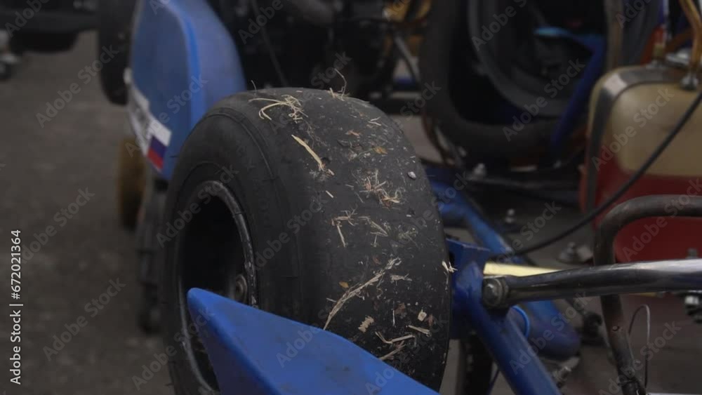 Preparing a racing kart car for the race. Spinning wheel close up Preparing a racing kart car for the race. Spinning wheel close up