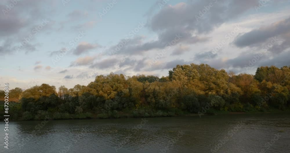 Autumn sunset of riverbank in Tisza at a windy day. Autumn sunset of riverbank in Tisza at a windy day.