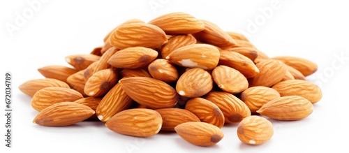 Isolated honey and almond nuts or badam on a white background Represents the idea of superfood nutritious snacks and traditional sunnah food photo