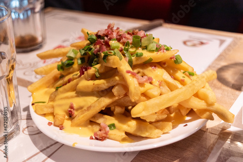 Fries with cheddas on a plate