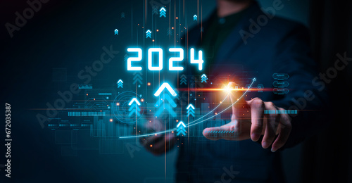 Businessman touching increase arrow graph corporate future growth year 2023 to 2024. New Goals with Plans and Visions for Next Year 2024, Opportunity, challenge and business strategy.