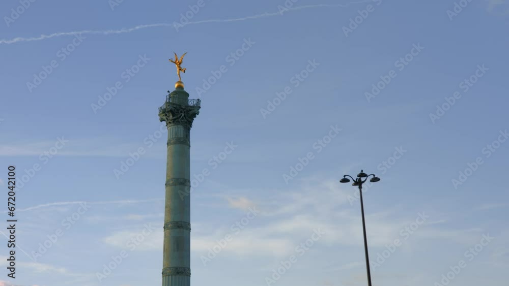 Golden monument of Paris against blue sky, view from bellow Golden monument of Paris against blue sky, view from bellow