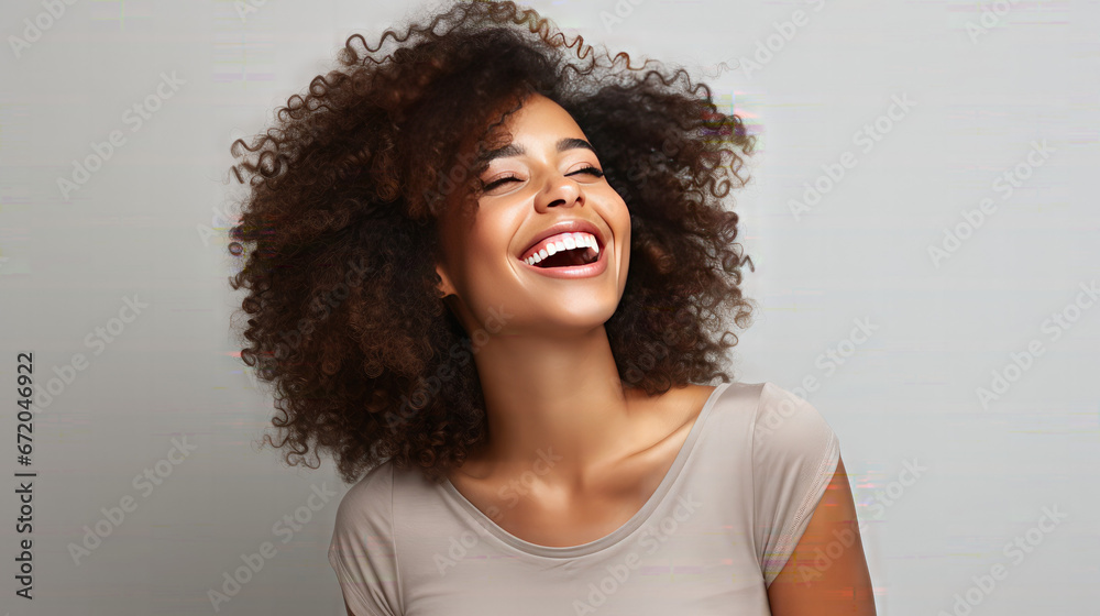 Happy black skinned woman with curly hair enjoys the moment. Isolated on a White Background Happy black skinned woman with curly hair enjoys the moment. Isolated on a White Background