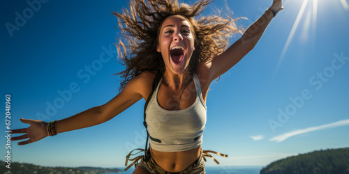 Young woman bungee jumping at high speed. photo