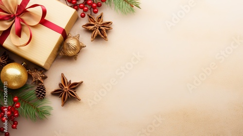 Golden Christmas gift box, fir branches, and festive decorations on light gold background, top view with copy space