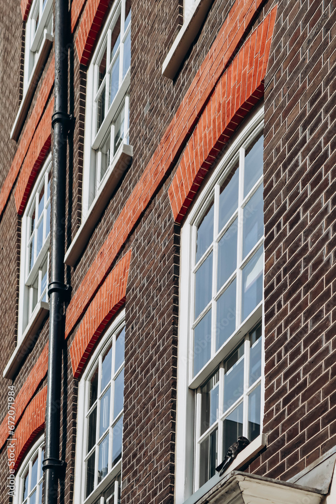 Facade in the beautiful Mayfair district in the West End of London, on an autumn warm day Facade in the beautiful Mayfair district in the West End of London, on an autumn warm day