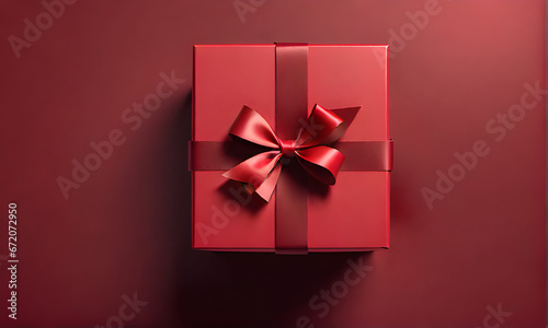 red 3D gift box with ribbon and bow on a red background in a minimalist style
