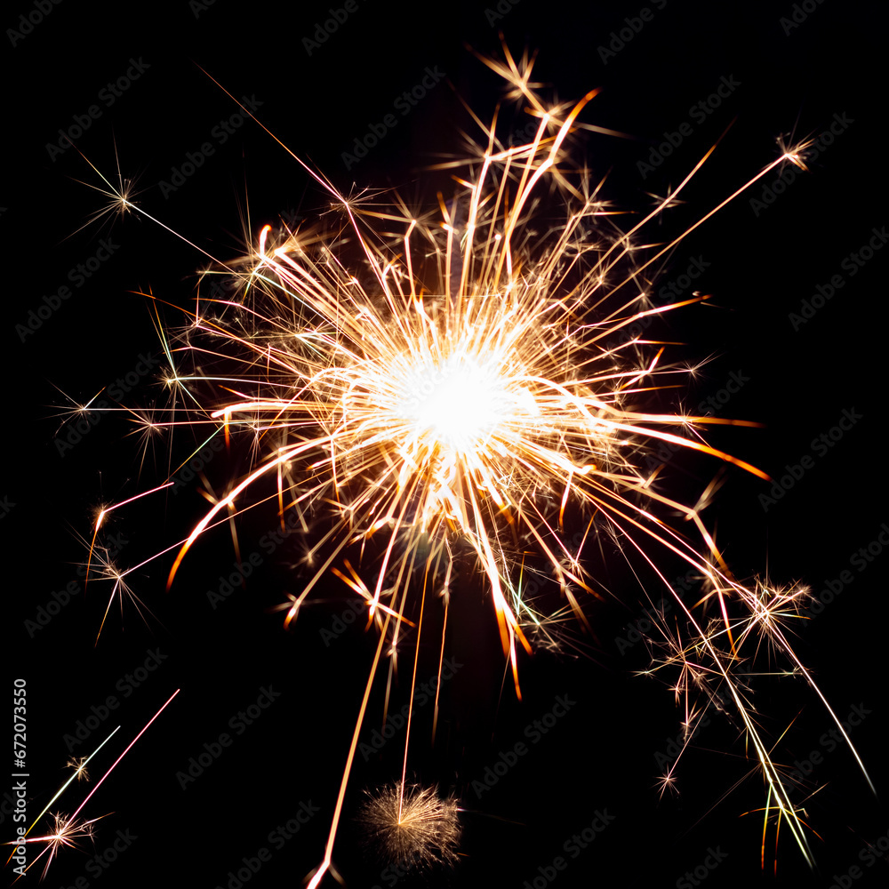 Sparklers on black isolated background. Sparks from a burning sparkler. To insert an image in a blend mode Sparklers on black isolated background. Sparks from a burning sparkler. To insert an image in a blend mode