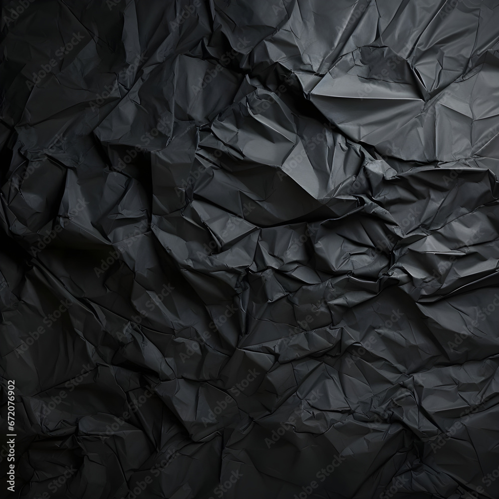 Black wrinkled paper texture. Black crumpled paper texture with folds, black background, wallpaper. Black wrinkled paper texture. Black crumpled paper texture with folds, black background, wallpaper.