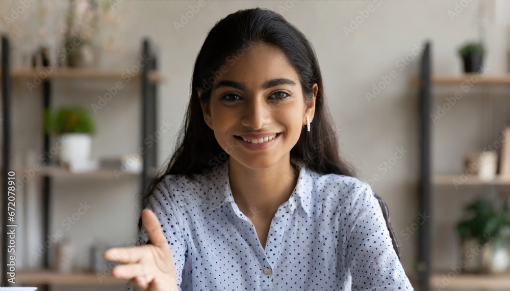 Young indian woman online teacher, counselor, remote tutor or job applicant speaking looking at web cam giving online training, virtual class lesson, video call interview. Webcam view Young indian woman online teacher, counselor, remote tutor or job applicant speaking looking at web cam giving online training, virtual class lesson, video call interview. Webcam view