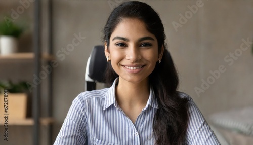 Young indian woman online teacher, counselor, remote tutor or job applicant speaking looking at web cam giving online training, virtual class lesson, video call interview. Webcam view