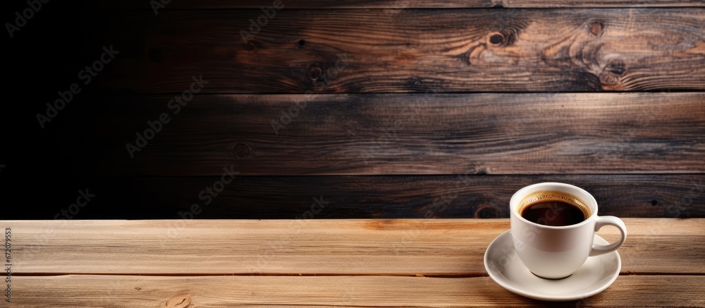 Coffee cup resting on a table made of wood