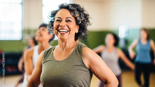 Middle-aged women enjoying a joyful dance class. Dancers exercising in a dance studio.
