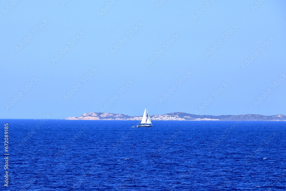 Boat in front of Bonifacio beacon , Corsica, France Boat in front of Bonifacio beacon , Corsica, France