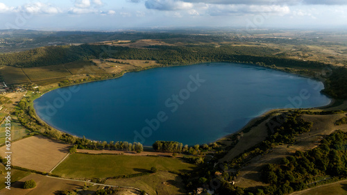 Aerial view of Lake Martignano, originally called Lake Alsietino. It is an endorheic lake of volcanic origin located in Lazio, Italy.